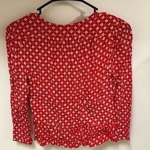 Red flowery blouse